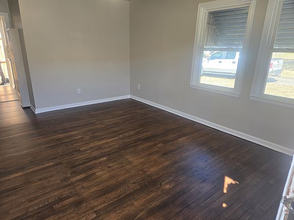 living room with hardwood floors and lots of natural light