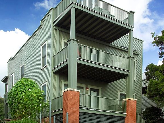 Back of building with roof deck