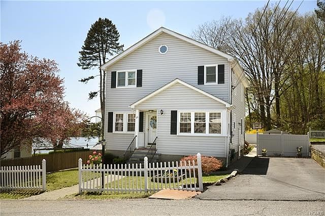 Welcome to 88 14th Street.  This delightful colonial home features views of Lake Meahagh.
