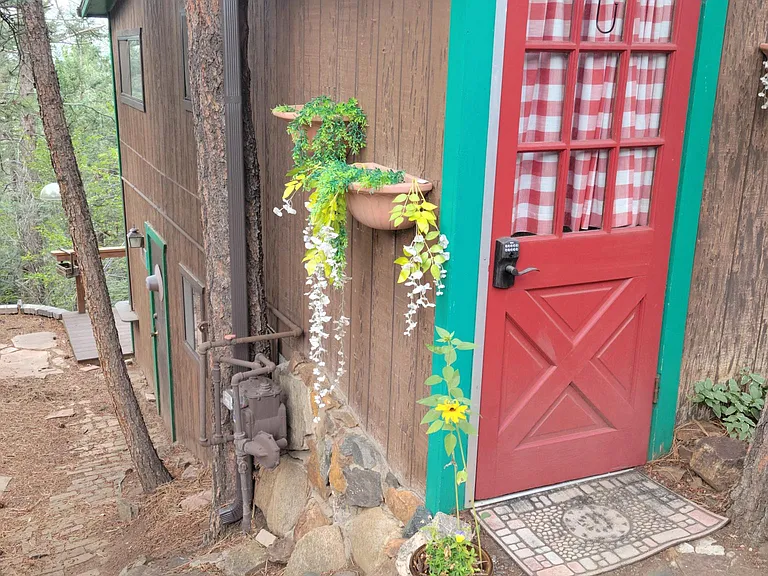 Little steps to the left of your door lead to a small area with a fire pit.