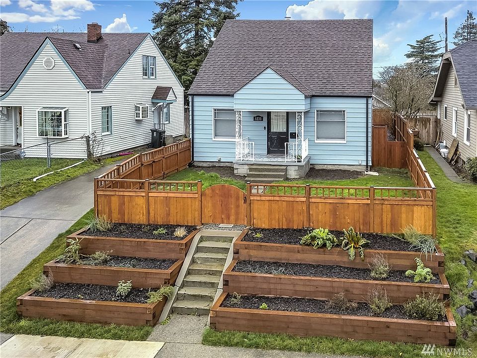 Sweet Tacoma Craftsman! New fence & terraces for gardening. Shared driveway on left leads to a parking space and oversize single garage