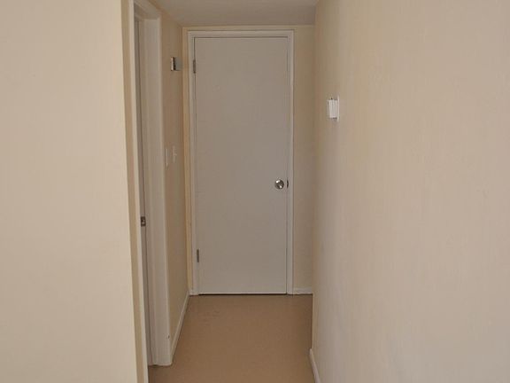 The hallway leads to the bedroom on the left. Large storage closet straight ahead and bathroom off to the right.