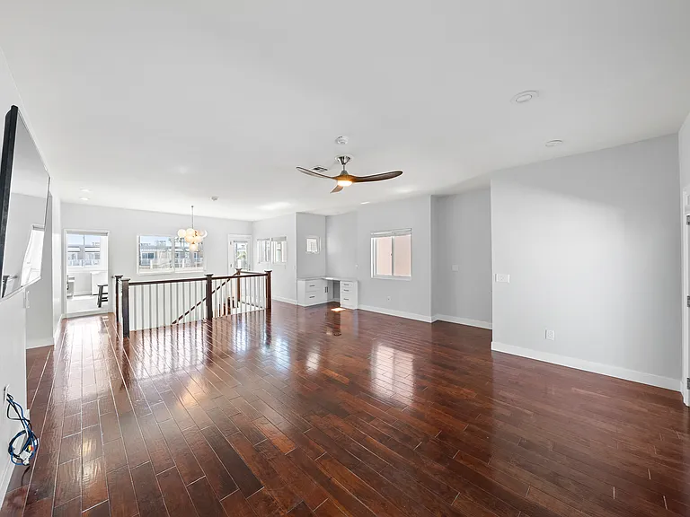 Living room with doors to California room and main deck overlooking Noble park and The Pier
