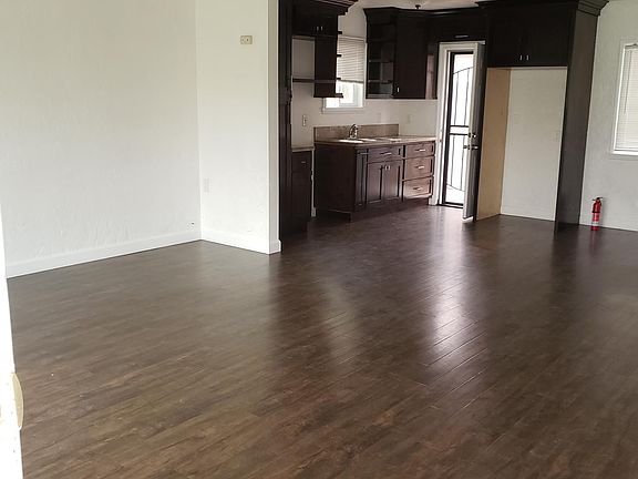 Living-room with connected kitchen