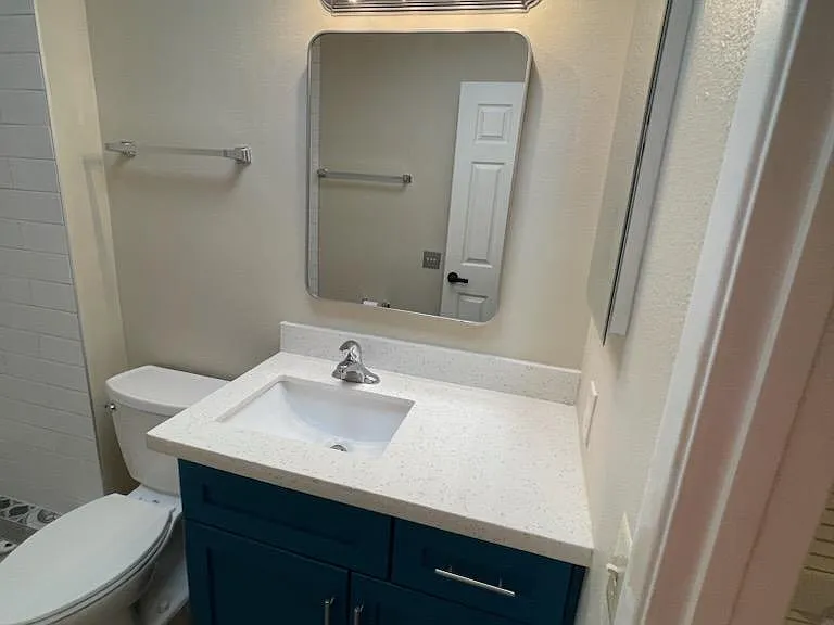New lighting, new mirror, new quartz counters, new sink and faucet.