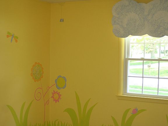 Professionally painted flower and bug mural
