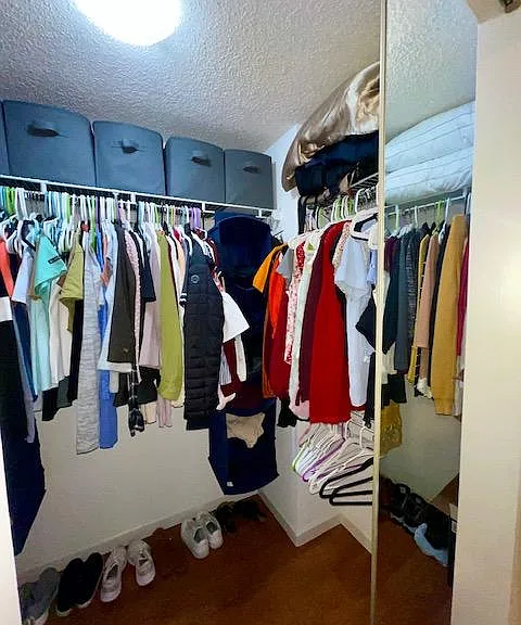 Walk-in closet with tons of space. Full shelved 3 sides. More space than needed.