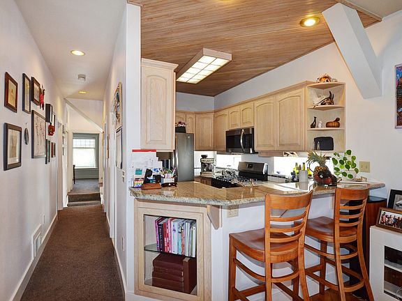 Hall to bedroom 2 and kitchen bar
