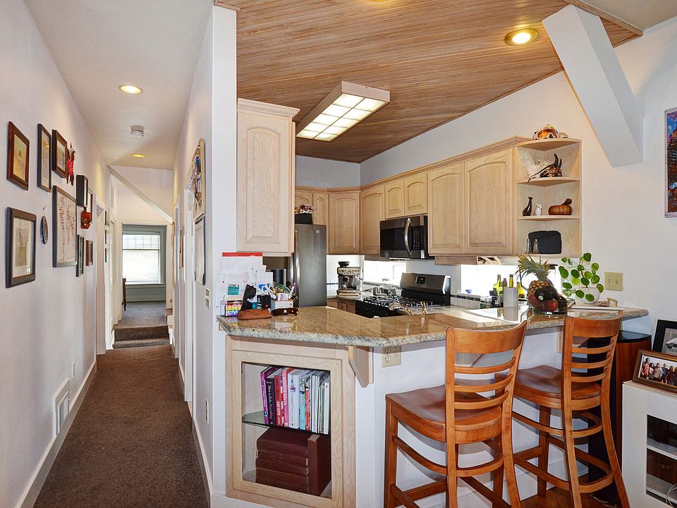 Hall to bedroom 2 and kitchen bar