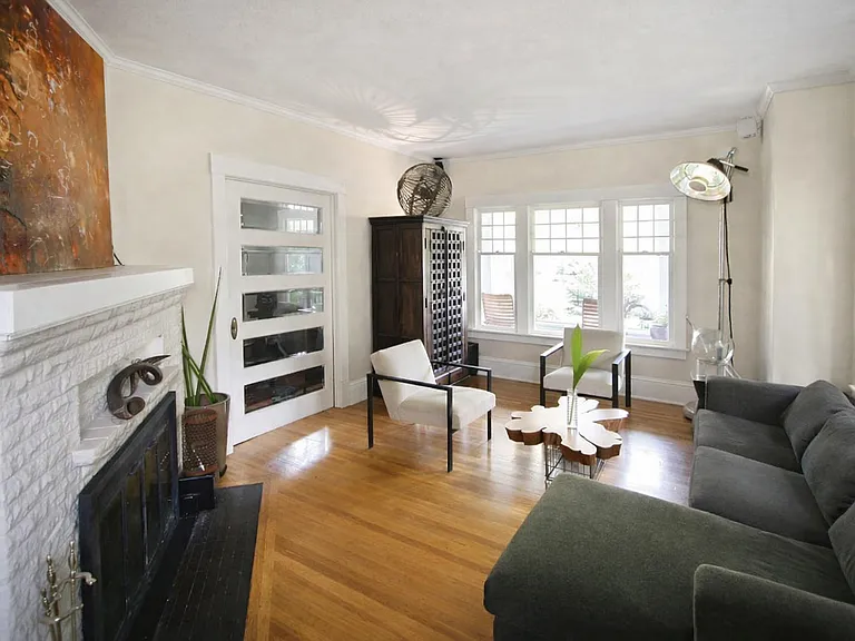 Living room w/ beveled glass pocket door (facing East)