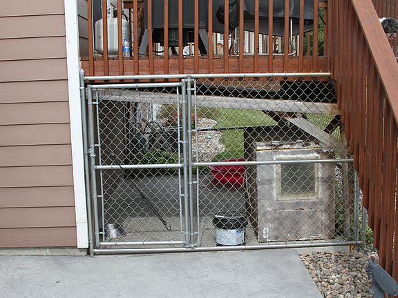 Dog kennel under deck