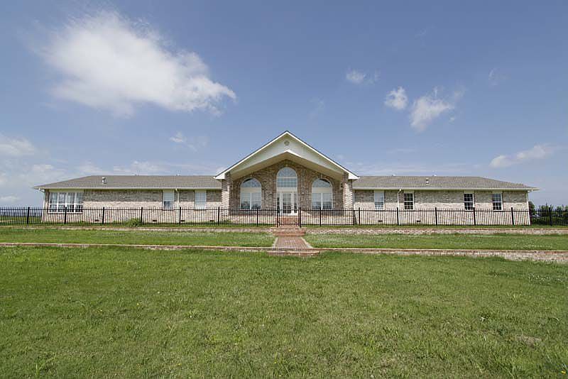 Beautiful 1 Story Brick on 8+ Acres m/l.