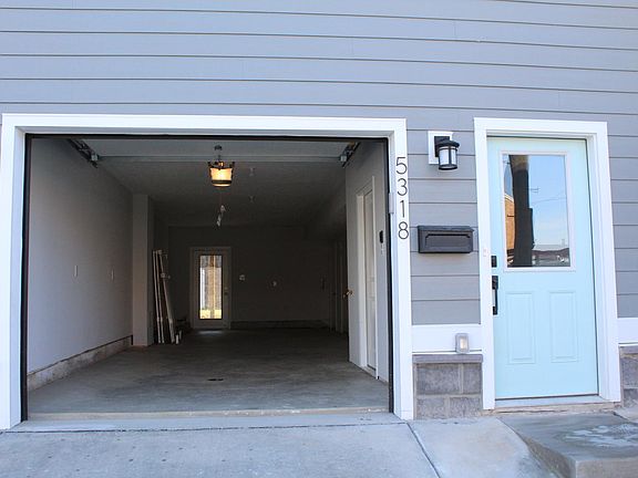 2 car tandem garage with direct access to house. Walk out door to the backyard.