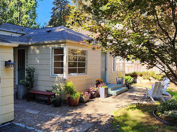 driveway easily accommodates 3 vehicles, garage for 1 small car or hobbies