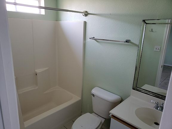 Hall bathroom connects to the second bedroom through another door (see in the mirror).