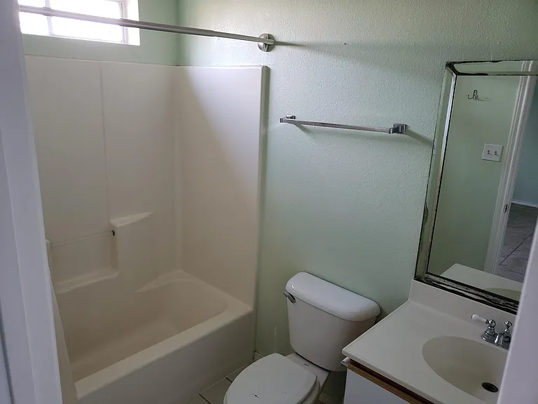 Hall bathroom connects to the second bedroom through another door (see in the mirror).