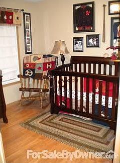 Bedroom 3 : Pergo flooring just installed in spring 2011 with tan walls