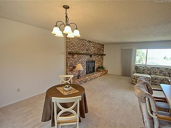 Open, warm kitchen with brand new floors!