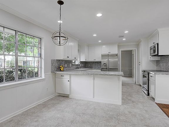 Breakfast room and kitchen open up to the family room.