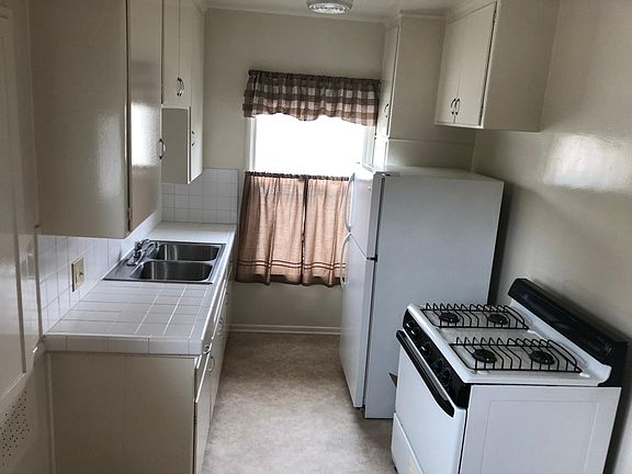 Stove oven refrigerator and Garbo included lots of storage and stainless steel sink Two windows one faces north and the other East 14.6ft X 7ft