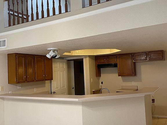Kitchen with view of loft located on second floor. Loft is open to first floor