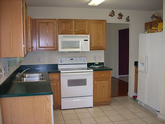 Overhead Microwave with Self Cleaning Smooth Surface Range with Refrigerator