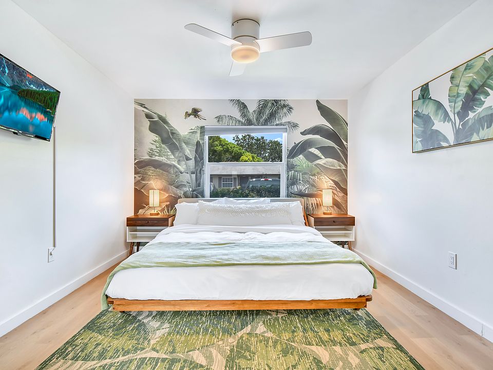 Relax in the spacious primary bedroom featuring a king-size gel memory foam bed and blackout shades for maximum comfort, support, and uninterrupted sleep.