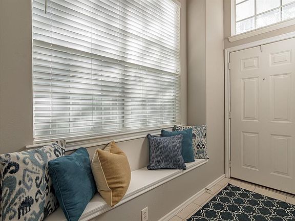 Your guests are greeted by a dramatic foyer which includes window seat and large windows.