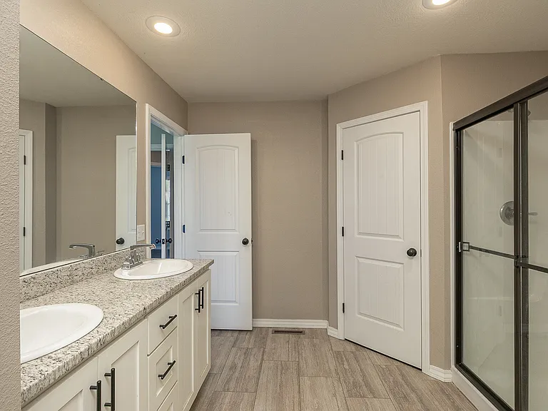 Large full bathroom with double sinks