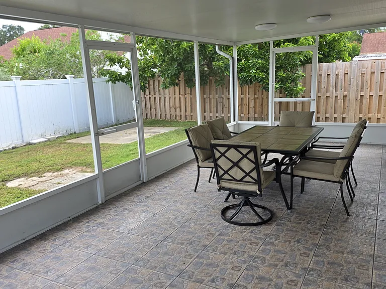 outside patio from corner inside screened area