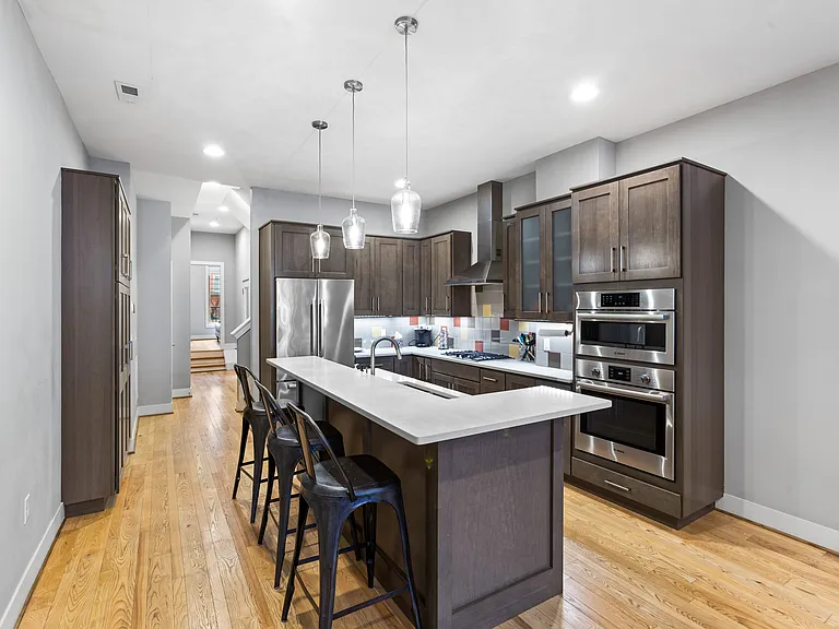 Kitchen - view from living room as you walk in the front door