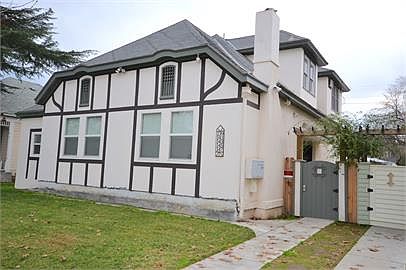 A multi-family building converted in the 40's to the tudor s