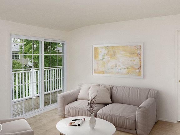 Living room and view of patio doors at Lakeside Village, East Patchogue