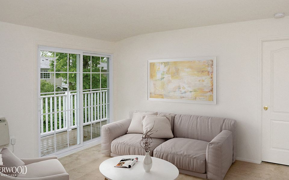 Living room and view of patio doors at Lakeside Village, East Patchogue