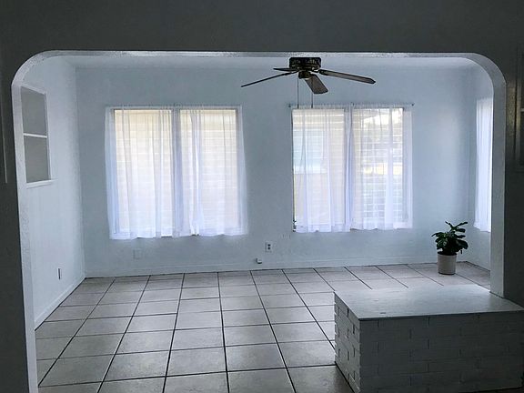 Nice sunlit room off to right of house entrance w/ sheers up
