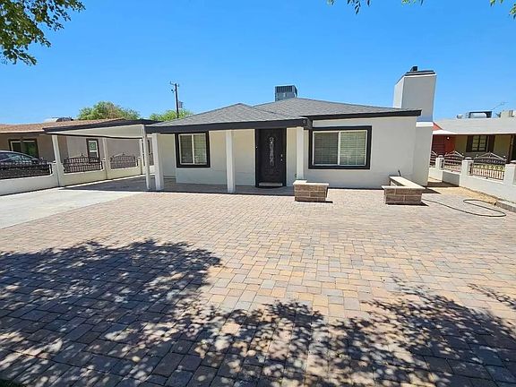 Large fenced yard with paved patio space_ideal for gatherings, pets, or quiet outdoor time.