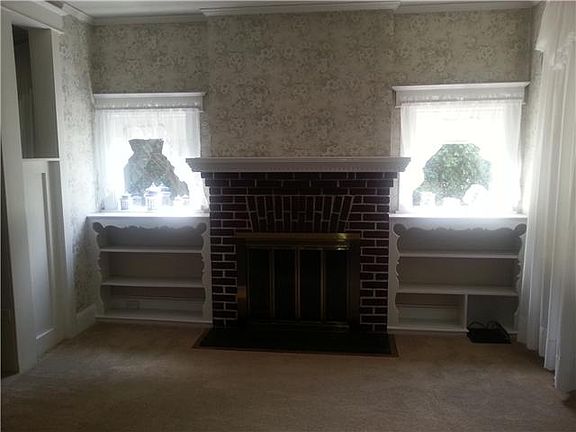 Living Room w/fireplace and built-ins.
