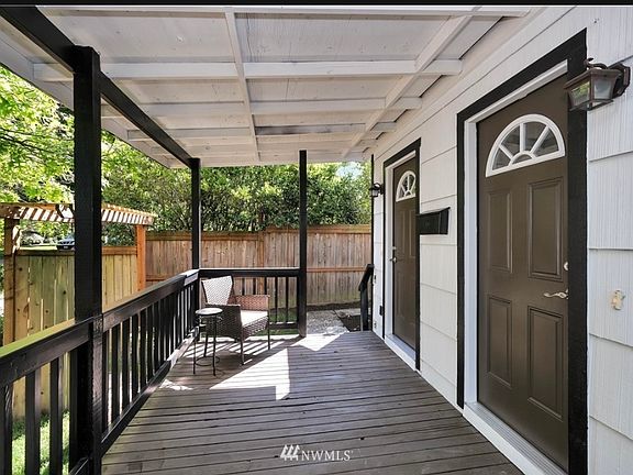 Welcoming covered porch area with space for outdoor seating. A private and secure entryway to this well-maintained rental property.