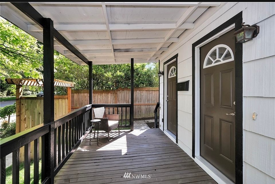 Welcoming covered porch area with space for outdoor seating. A private and secure entryway to this well-maintained rental property.