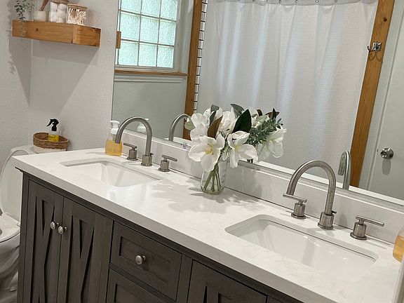 Newly updated bathroom with subway tile bath/shower and double sink. Lots of shelf and storage space.
