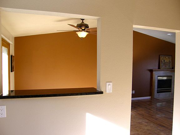 Kitchen bar opening to dining room with walkout