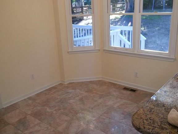 Eat-in kitchen with marble floors