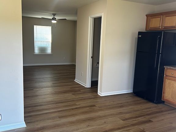 view from back door looking into kitchen and living room