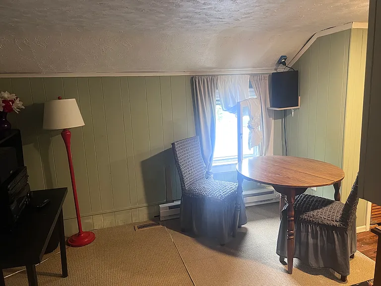 Rec/dining area with large TV and stereo