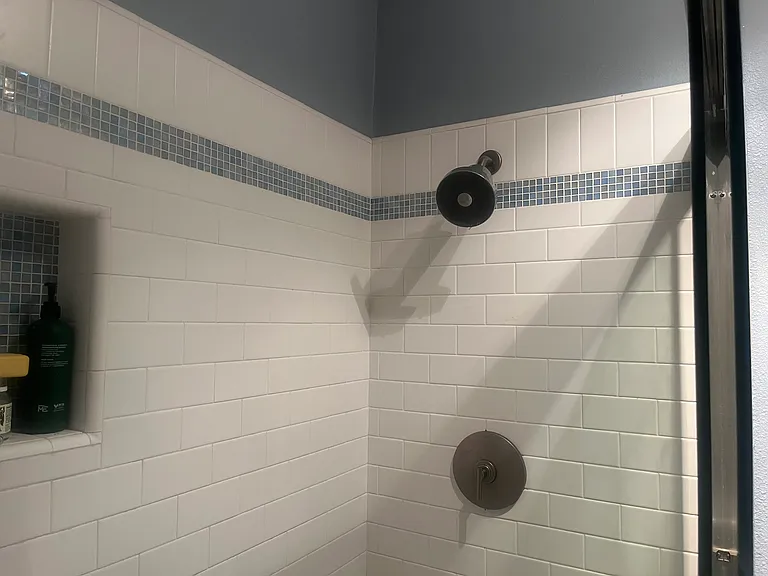 Jolie filtered shower head from Erewhon: filters chlorine, heavy metals, and impurities for healthier skin and hair. (New shower filters are included in rental.)