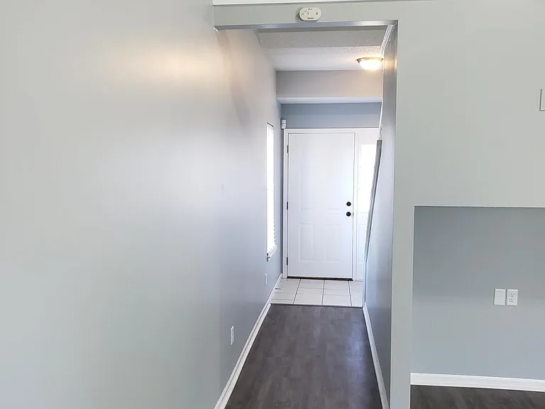 View of front door from living room