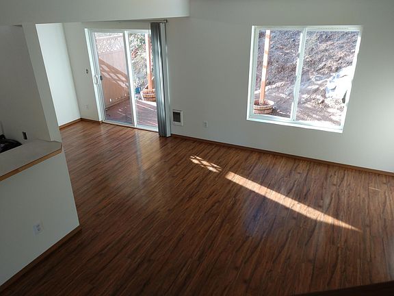 Open living and dining room spaces.