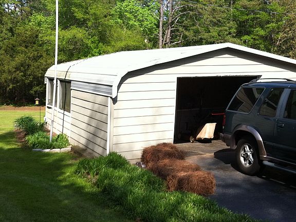 Garage for lawn equipment an