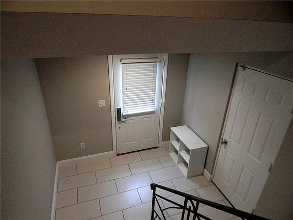 Spacious foyer entry, coat closet and door to the garage.
