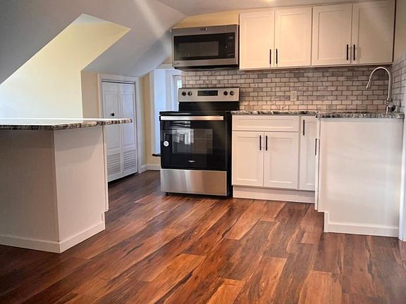 Breakfast Bar and Kitchen Pantry Closet tucked in the corner